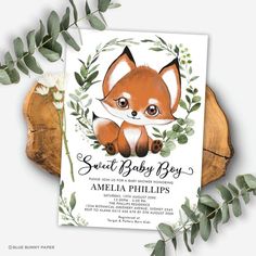 a baby shower with a fox and leaves on it