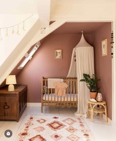 a baby crib in the corner of a room with a rug on the floor