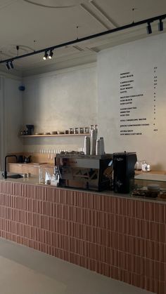 there is a coffee machine sitting on the counter in this restaurant bar, and it's time to order