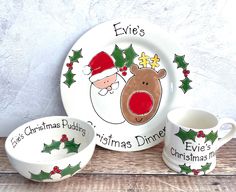 three christmas themed dishes with santa clause on them