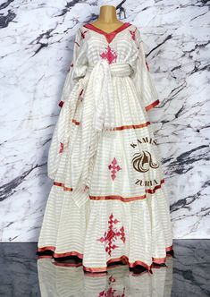 Beautiful Ethiopian and Eritrean Habeshan Dress. Stylish Menen, 100% Cotton We recommend hand washing and air drying to make it last longer. A low heating iron will also keep design and look. Beautiful Habeshan Dress |Ethiopian Traditional Dress|Eritrean Dress|Habesha Kemis|Zuria|Habesha Chiffon|Kemis Pink Traditional Drape Dress For Spring, Traditional Pink Dress For Spring, Pink Spring Dress With Traditional Drape, White Anarkali Dress For Traditional Ceremonies, White Dress With Traditional Patterns For Eid, White Maxi Sets For Traditional Ceremonies, White Traditional Drape Maxi Dress, White Kaftan With Traditional Patterns For Navratri, Eid Anarkali Dress With Long Skirt