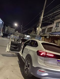 a car with its door open on the street