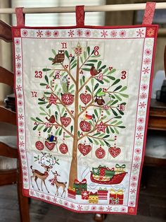 a christmas tree quilt hanging from a chair