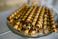 several pieces of food are arranged on a glass platter and ready to be eaten