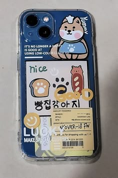 a cell phone case with an image of a cat and other things on the back