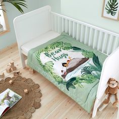 a child's bed with a jungle theme on it