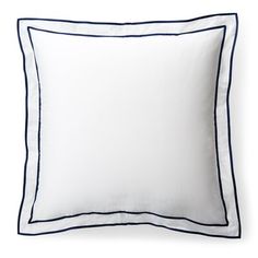 a white pillow with blue piping on the front and back side, against a white background