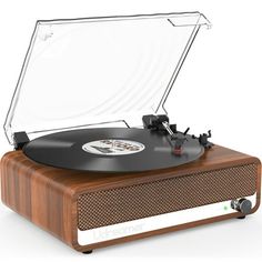 an old - fashioned record player is shown with its wooden case and clear glass cover