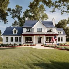 a white house with an american flag on the front lawn