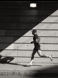 black and white photograph of a man running