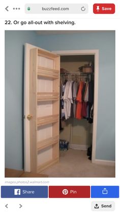 an open closet with clothes on hangers and shoes hanging from the door to the other side