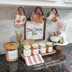 the hot cocoa bar is set up on the counter