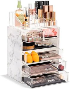 an acrylic makeup organizer with multiple compartments