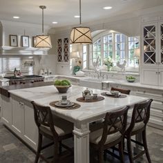 a large kitchen with an island in the middle