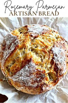 an artisan bread with rosemary on top and the words rosemary parmesan artisan bread