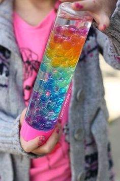 A rainbow sensory bottle that is beautiful to look at and fun to enjoy. This bottle was inspired by the separation that occurs when you mix water and oil. I found myself wondering, “well, wha… Rainbow Sensory Bottles, Calming Bottle, Rainbow Sensory, Calm Down Bottle, Diy Fidget Toys, Sensory Crafts