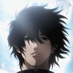 a man with black hair standing in front of clouds