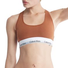 A Calvin Klein icon, crafted in a natural color palette. Designed with the original Calvin Klein logo band, this women's bralette is a sporty look that will leave you feeling sexy everyday. A Calvin Klein icon, crafted in a natural color palette. Designed with the original Calvin Klein logo band, this women's bralette is a sporty look that will leave you feeling sexy everyday.Click on this INTIMATES & SLEEPWEAR Guide to find the perfect fit and more! Wireless Racerback Soft, flexible Calvin Klei Calvin Klein Spring Tops For Everyday Wear, Trendy Everyday Sports Bra, Calvin Klein Spring Everyday Tops, Casual Medium Support Cotton Bra, Casual Cotton Bra With Medium Support, Cropped Sports Bra With Medium Support, Casual Everyday Sports Bra, Calvin Klein Athleisure Tops For Sports, Sporty Calvin Klein Tops For Sports