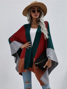 Master the art of mod layering with this cozy knit poncho that flaunts oversize kimono sleeves and a bold color block print. Size Guide: Melina is 5’6” tall, and has a 33.5” bust, 24.8”waist, & 37.4” hips. She is wearing a S / US 4 / AU 8. This poncho is true to size. Material: 50% viscose / 30% polyamide / 20% polyester Feature: Color block poncho. Oversize for comfort fitting. Care Instructions: Machine wash / Cold hand wash Costume Africain, Loose Knit Cardigan, Women Long Cardigan, Cardigan Oversized, Sleeveless Outfit, Women Shawl, Handkerchief Hem, Loose Knit, Loose Tops