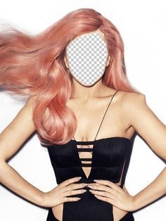 a woman with long pink hair standing in front of a white wall and holding her hands on her hips