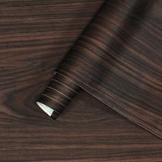 the wood grained surface is very dark brown