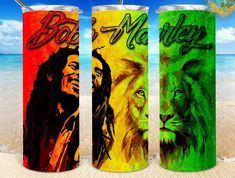 three different colored cans with the same image on them, one has a lion and two lions