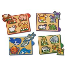 four wooden puzzles with different animals on them