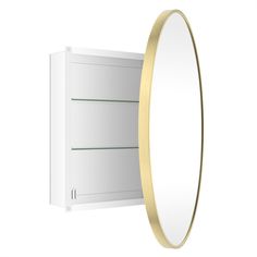 an empty white cabinet with a gold rim around the edge and a round mirror above it