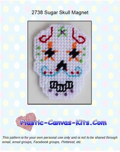 a cross stitch sugar skull is shown with the words,'sugar skull magnet '