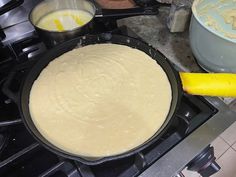 a pan filled with batter sitting on top of a stove