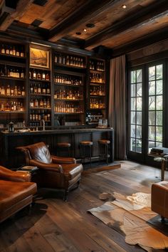 a living room filled with leather furniture and lots of bottles on the wall behind it