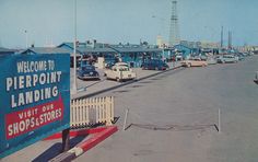 a parking lot filled with lots of cars and trucks