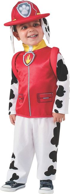 a little boy dressed up as a fireman in his dalmatian costume for halloween