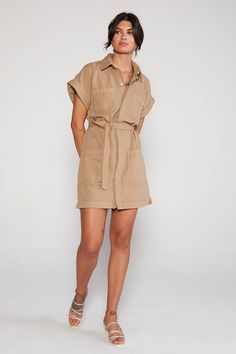 An easy-fitting safari dress with utility pocket details and self belt. Natural mineral dyes and a lofty organic twill fabric add a cool vintage texture. Made with recycled lyocell, an upcycled cellulose fiber made from recycled material. Cotton is OCS-Certified Organic, grown without the use of artificial fertilizers, pesticides or genetically modified seeds, using less water than conventionally grown cotton. Dyed using natural mineral dyes. Hangtags, labels and packaging made entirely from rec Safari Outfits, Utility Dress, Safari Dress, Cellulose Fiber, Vegan Clothing, Safari Party, Genetically Modified, Vintage Texture, Fabric Belt