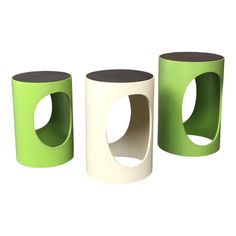 three green and white vases sitting next to each other