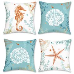 four pillows with seahorses and starfish on them