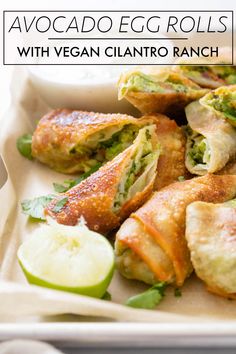 some food is sitting on a tray and ready to be eaten with dipping sauces