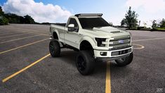 a white truck parked in a parking lot