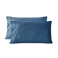 two blue pillows sitting on top of each other