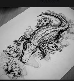 a drawing of a dragon with flowers on it