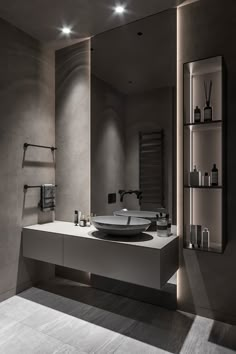 a bathroom with a sink and shelves in it