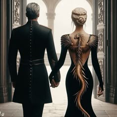 a man and woman dressed in black holding hands