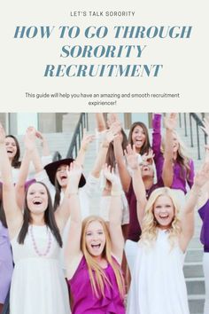 a group of young women standing next to each other with their hands in the air