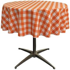 a red and white checkered tablecloth on a metal base