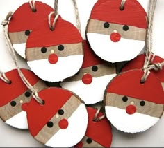 christmas ornaments with santa claus on them are hanging from twine strings and tied together