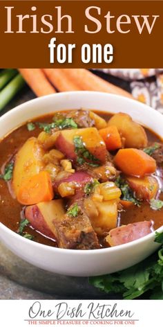 irish stew for one with carrots, potatoes and celery in a white bowl