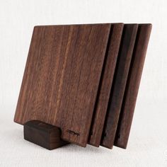 These beautiful handmade coasters measure 5" x 5" and include a base for easy and convenient storage purposes. Made from solid walnut wood. Comes in a set of 4 coasters with a coordinating base for easy storage.   Coat with our board conditioner (sold separately) to reduce color loss and distortion due to moisture and condensation!   *This listing uses professional photography to provide samples of our collection of products. Each stone is natural, unique and beautiful so please expect slight variations in color, texture, and size. You will receive a product similar to that of the picture, but not the exact product. Handmade Coasters, Engraved Gifts, Wood Coasters, Bar Tools, Solid Walnut, Professional Photography, Tools Accessories, Walnut Wood, Easy Storage