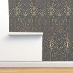 the wall paper is designed with gold lines