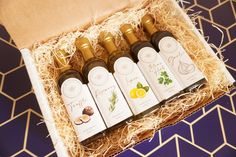 four bottles of olive oil in a gift box