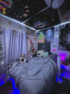 a bedroom decorated in black and white with lots of decorations on the ceiling, walls and windows